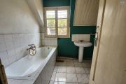 À vendre une villa à étage de type F5 avec mezzanine située à Ankadikely Ilafy sur un terrain de 663m2 bord de route goudronnée